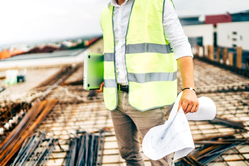 Construction worker wearing a bright green vest